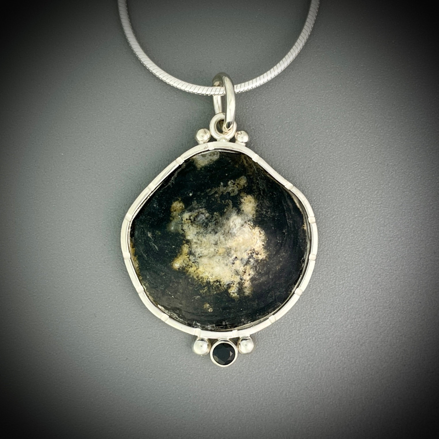 black jingle shell pendant